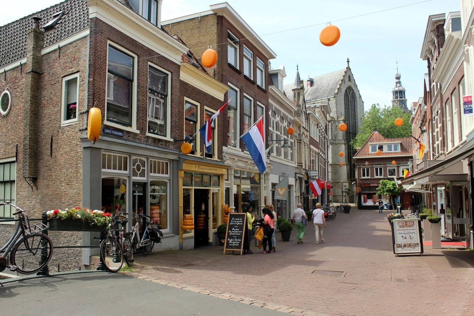 Historic market square and traditional streets in Gouda during a private journey from Rotterdam