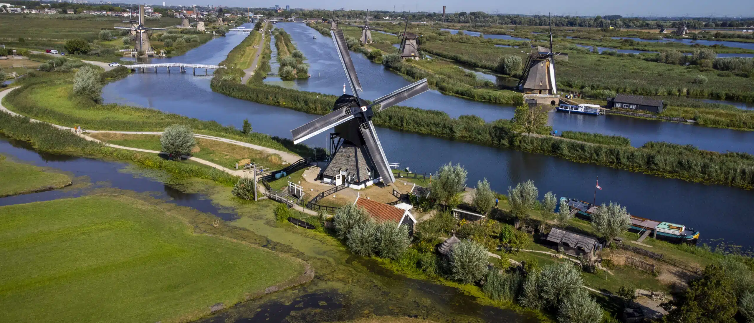 Panoramic view of the historic Kinderdijk windmills and waterways