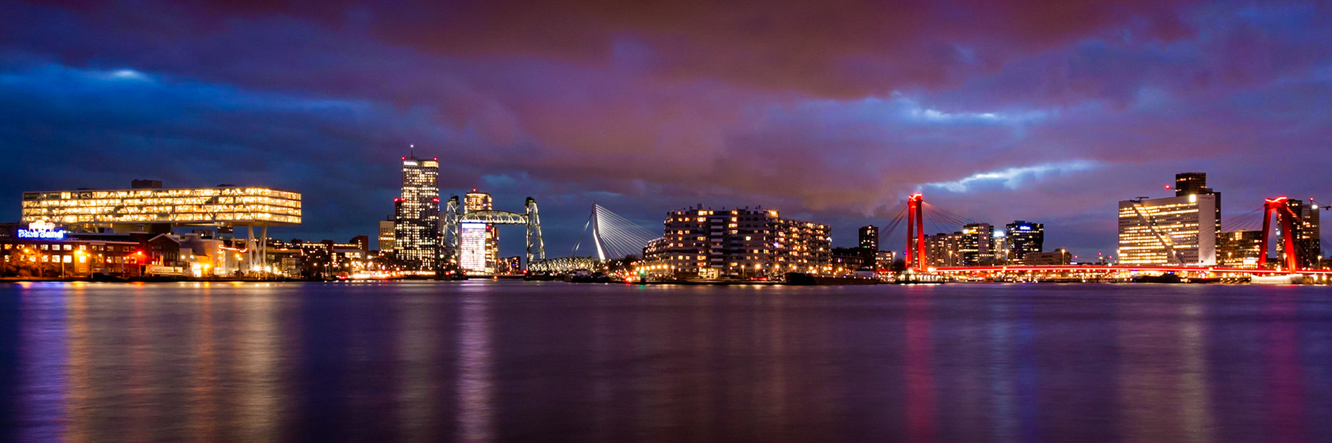 Illuminated Rotterdam skyline with the Erasmus Bridge, De Hef and Willemsbrug at night